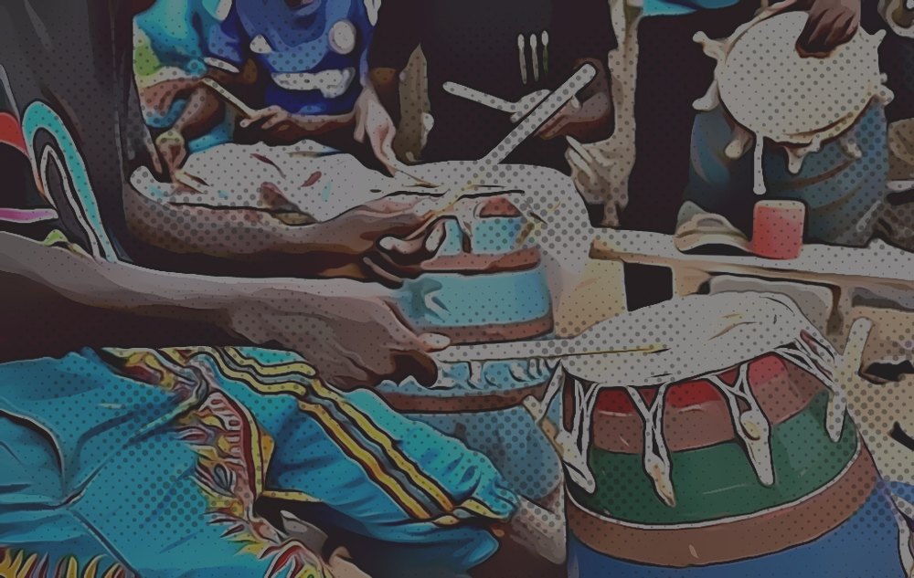 Drummers mid-performance at a live event